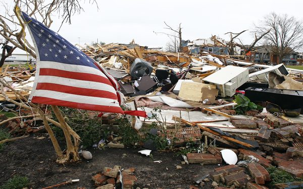 epaselect epa05082648 A US flag flies among the debris of an apartment building, in Garland, Texas, USA, 28 December 2015, after it was damaged on 26 December 2015 when a string of tornados ripped through Garland. A large weather system packing snow, ice and heavy rain hammered the mid-section of the United States on 28 December 2015 following a weekend of violent weather that claimed 43 lives in seven states. Entire residential areas near Dallas were turned into rubble heaps by tornadoes that devastated a corridor several kilometres long. Four districts have been declared disaster areas.  EPA/MIKE STONE