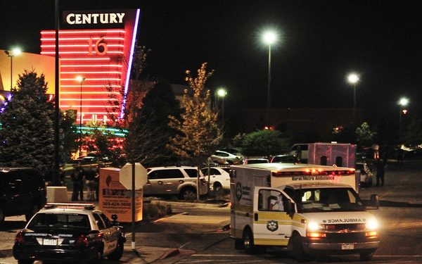 epa03312104 epa03312099 An ambulance is parked outside the Century 16 Theater in the Town Center Mall in Aurora, Colorado, USA early 20 July 2012, after a gunman killed 14 people and wounded 50 in a shooting incident at the premiere of the latest Batman movie 'The Dark Knight Rises'.  EPA/BOB PEARSON RE-CROPPED VERSION