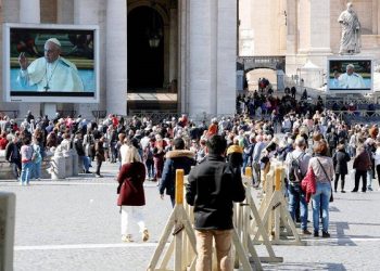 Pope Francis delivers his weekly Angelus prayer via video transmitted on the screen on St. Peter's Square, in Vatican March 8, 2020. REUTERS/Remo Casilli