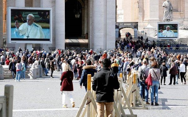 Pope Francis delivers his weekly Angelus prayer via video transmitted on the screen on St. Peter's Square, in Vatican March 8, 2020. REUTERS/Remo Casilli