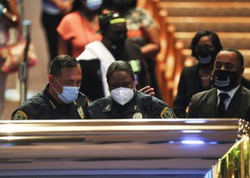 epa08473348 Houston Police Department chief Art Acevedo and assistant chief Sheryl Victorian visit the open casket during a public visitation for George Floyd at the Fountain of Praise church, in Houston, Texas, USA, 08 June 2020. A bystander's video posted online on 25 May, appeared to show George Floyd, 46, pleading with arresting officers that he couldn't breathe as an officer knelt on his neck. The unarmed Black man later died in police custody and all four officers involved in the arrest have been charged and arrested.  EPA-EFE/Godofredo A. Vasquez / POOL