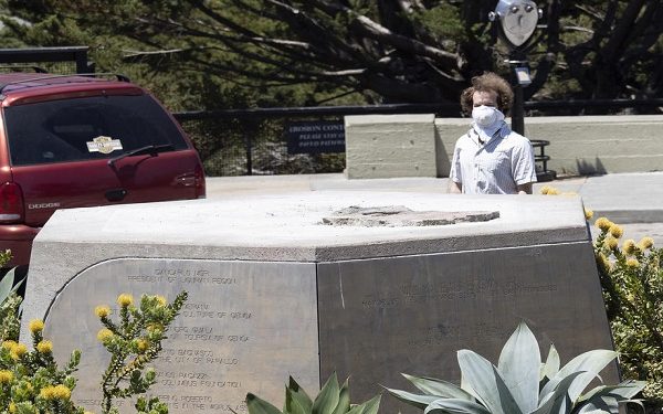 A person looks at the empty pedestal where a statue of Christopher Columbus once stood next to Coit Tower overlooking the Golden Gate Bridge and the San Francisco Bay in San Francisco, USA, 18 June 2020. San Francisco officials quietly removed the 4,000 pound statue in the early morning. For many Native Americans the statue has always been associated with slavery, subjugation, and conquest.  EPA-EFE/JOHN G. MABANGLO