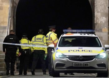 Police gather at a cordon close to the scene where reports state that three people were stabbed in Forbury Gardens, Reading, Britain, 21 June 2020.  EPA-EFE/WILL OLIVER