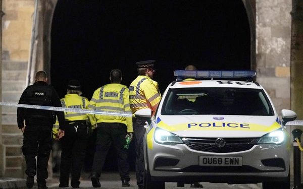 Police gather at a cordon close to the scene where reports state that three people were stabbed in Forbury Gardens, Reading, Britain, 21 June 2020.  EPA-EFE/WILL OLIVER