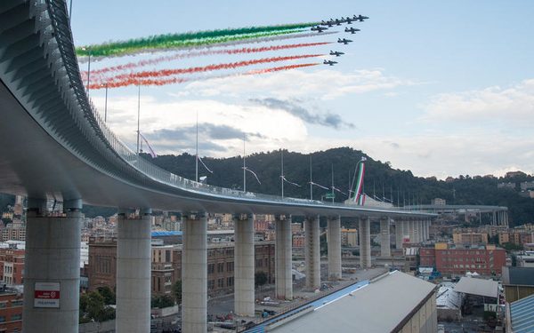 epa08582282 The 'Tricolour Arrows' (Frecce Tricolori), aerobatic demonstration team of the Italian Air Force, during the inauguration ceremony of the Genoa's new viaduct, two years after its predecessor, the Morandi bridge, collapsed in a disaster that claimed 43 lives, in Genoa, northern Italy, 03 August 2020. The new structure has been named Genoa San Giorgio Bridge.  EPA-EFE/LUCA ZENNARO