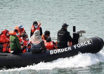 epa08597230 A Border Force vessel brings in migrants found off the coast of Dover Port in Dover, Britain, 11 August 2020. Migrants from Syria and other countries are continuing to arrive along the coast of the UK in their quest for asylum.  EPA-EFE/ANDY RAIN