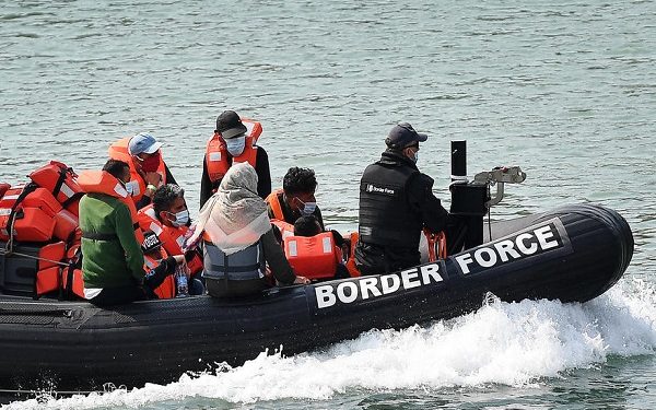 epa08597230 A Border Force vessel brings in migrants found off the coast of Dover Port in Dover, Britain, 11 August 2020. Migrants from Syria and other countries are continuing to arrive along the coast of the UK in their quest for asylum.  EPA-EFE/ANDY RAIN