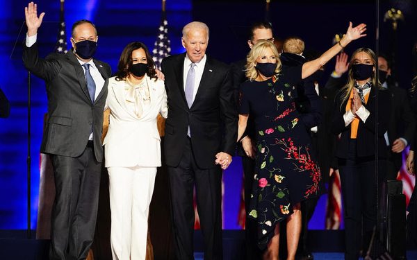 epa08806590 President-elect Joe Biden (2R) and Dr. Jill Biden (R) with Vice President Elect Kamala Harris (2L) and Doug Emhoff (L) are joined by family memebrs wave after Biden delivered his victory address after being declared the winner in the 2020 presidential election in Wilmington, Delaware, USA, 07 November 2020. Biden defeated incumbent US President Donald J. Trump.  EPA-EFE/JIM LO SCALZO