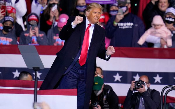 President Donald Trump moves to the song YMCA as he finishes a campaign rally at John P. Murtha Johnstown-Cambria County Airport in Johnstown, Pa., Tuesday, Oct. 13, 2020. (AP Photo/Gene J. Puskar)