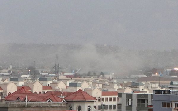 Smoke billows from the airport area after a blast outside the Hamid Karzai International Airport, in Kabul, Afghanistan, 26 August 2021. At least 13 people including children were killed in a blast outside the airport on 26 August. The blast occurred outside the Abbey Gate and follows recent security warnings of attacks ahead of the 31 August deadline for US troops withdrawal.  EPA-EFE/AKHTER GULFAM