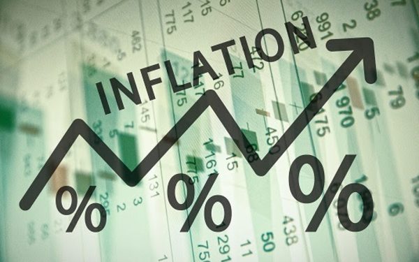 Word Inflation on up trend arrow, with financial data visible on the background.