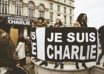 Bayonne, France - January 10, 2015: A large group of people gather in front of the city hall to protest against the terrorist attacks happened at Charlie Hebdo's headquarters and other locations at the french capital city.