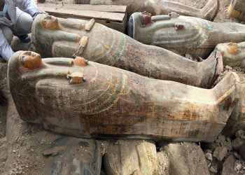 FILE - This Tuesday, Oct. 15, 2019 file photo provided by the Egyptian Ministry of Antiquities shows recently discovered ancient colored coffins with inscriptions and paintings, in the southern city of Luxor, Egypt. (Egyptian Ministry of Antiquities via AP)