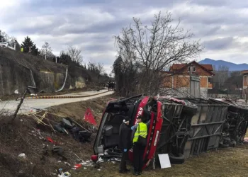 The investigators investigate the wreckage of a bus,in village of Laskarci near Skopje, North Macedonia, on 14 February 2019. According to officials, 14 people died and at least more than 20 were injured after a bus rolled over on the Skopje-Tetovo highway.