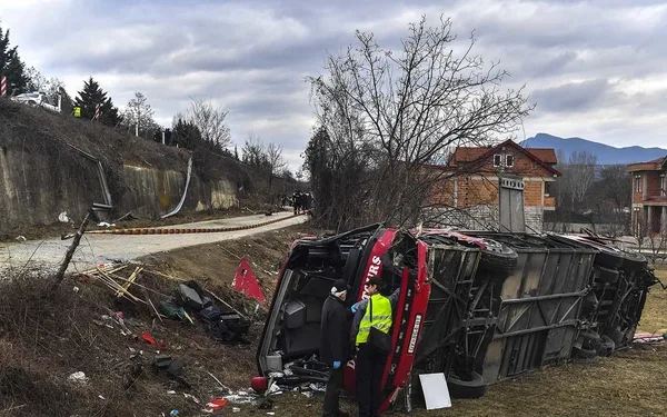 The investigators investigate the wreckage of a bus,in village of Laskarci near Skopje, North Macedonia, on 14 February 2019. According to officials, 14 people died and at least more than 20 were injured after a bus rolled over on the Skopje-Tetovo highway.