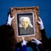 Personnel members hang for display a rare Vincent van Gogh painting, "Tete de paysanne a la coiffe blanche" (Head of an old farmer's wife with a white hat), painted circa 1884, that will be auctionned at the TEFAF Maastricht art fair, in Maastricht, on March 6, 2024. The TEFAF Maastricht art fair runs from March 9 to 14, 2024. (Photo by Nick Gammon / AFP)