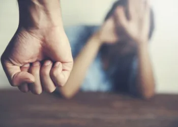 Man beating up his wife illustrating domestic violence